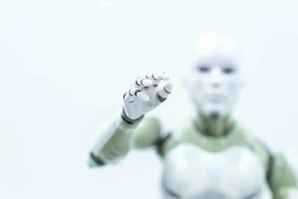 White Robot Reaching Hand Out