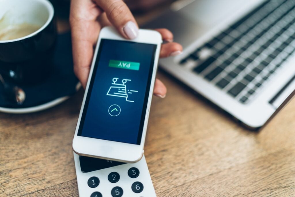 Hand Holding Mobile Phone Payment App